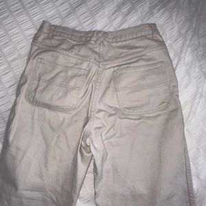 Cream colored high wasted straight leg 90s jeans